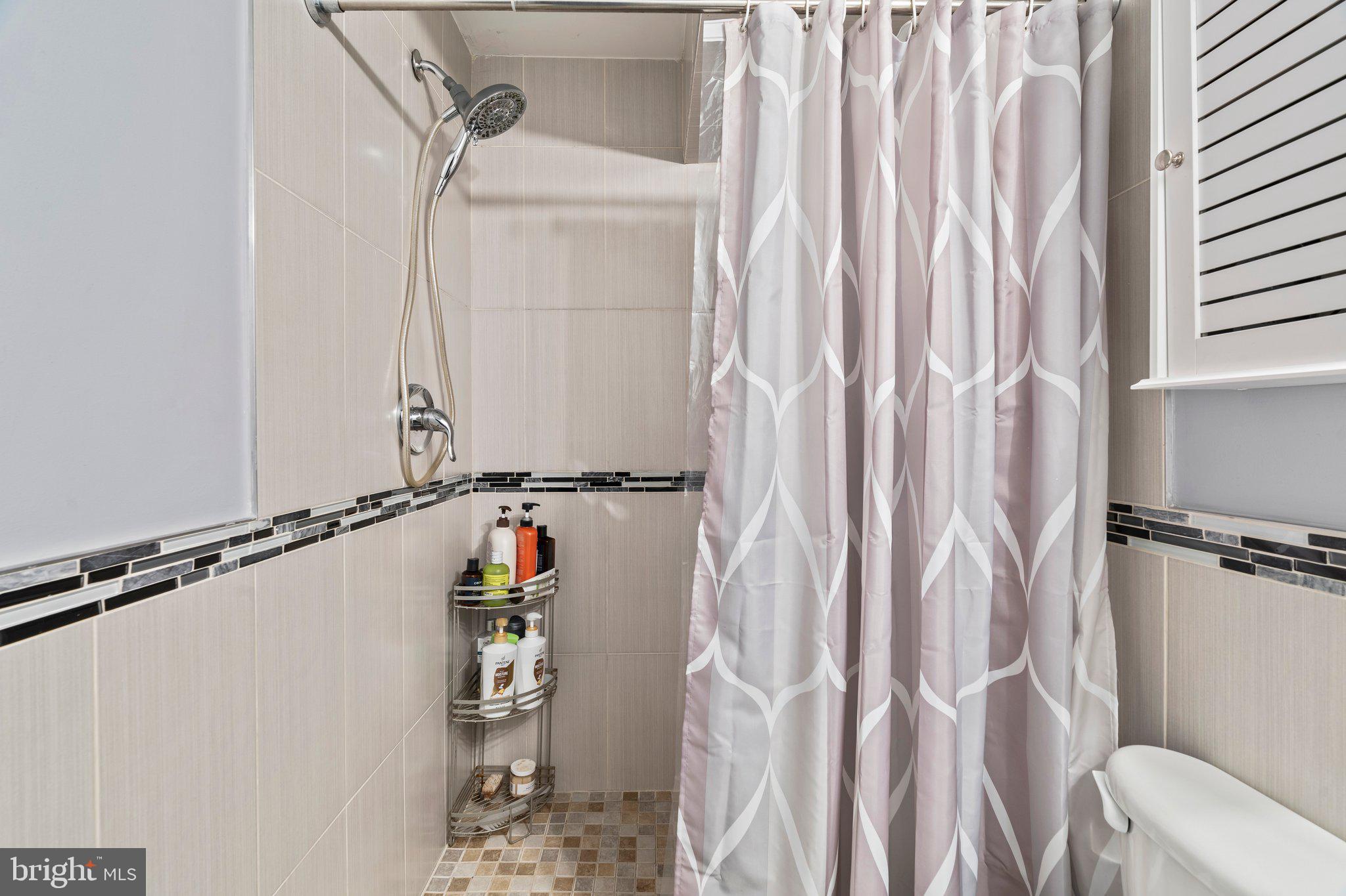 2115 Carpenter Street, Unit 1 Philadelphia, PA 19146 - Photo 24 of 24 a view of walk in closet with clothes and shoes