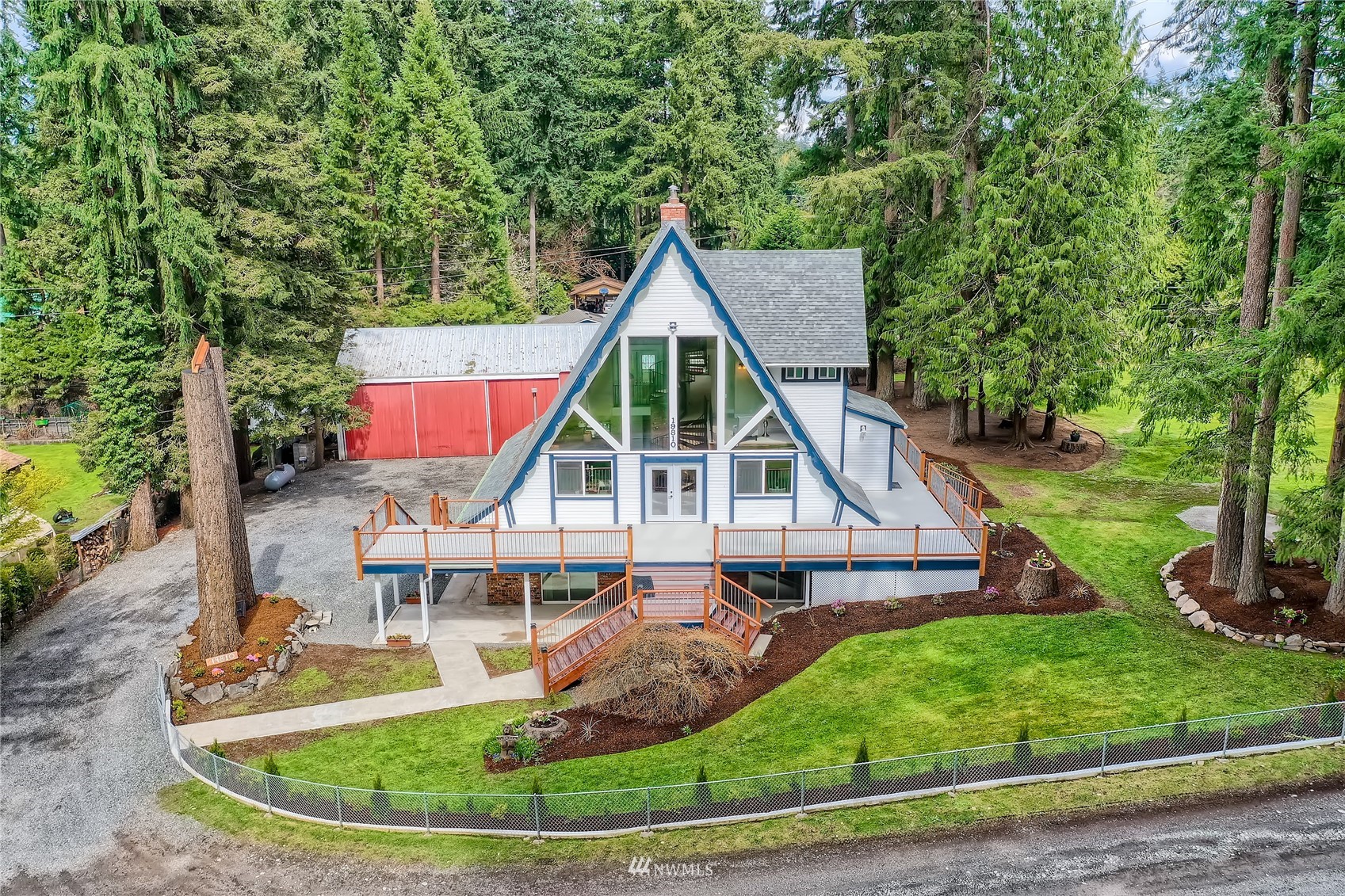 19810 43rd Avenue Southeast Bothell, WA 98012 - Photo 1 of 40 a view of a house with a small yard and sitting area