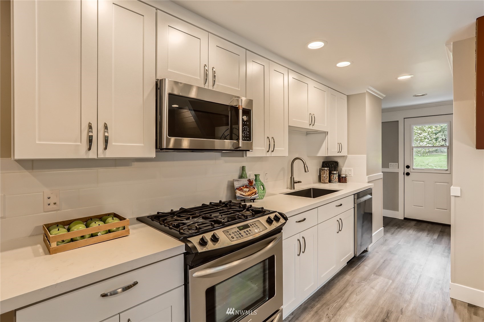 19810 43rd Avenue Southeast Bothell, WA 98012 - Photo 11 of 40 a kitchen with stainless steel appliances a white stove top oven and sink