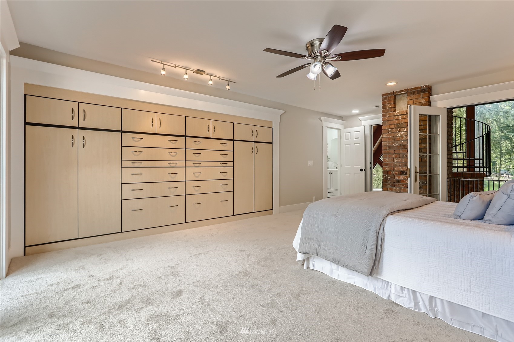 19810 43rd Avenue Southeast Bothell, WA 98012 - Photo 16 of 40 a bed room with a bed and a ceiling fan