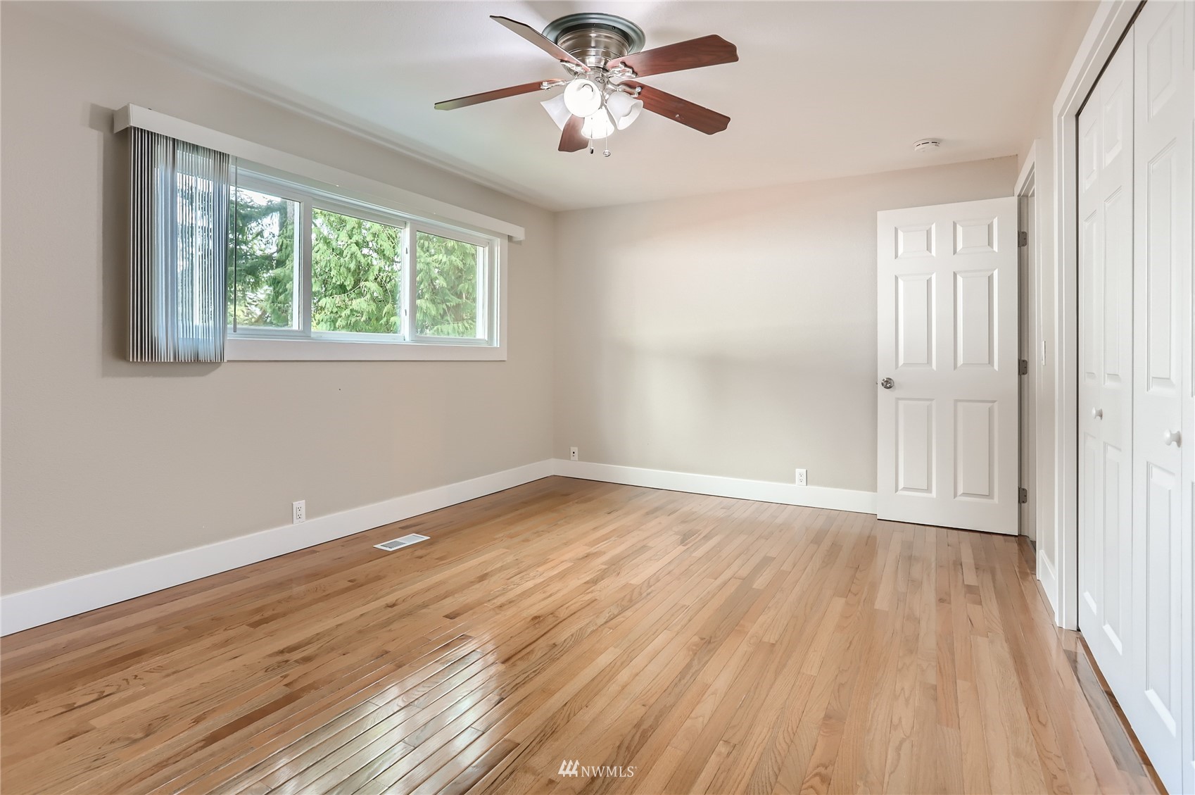 19810 43rd Avenue Southeast Bothell, WA 98012 - Photo 22 of 40 wooden floor in an empty room with a window