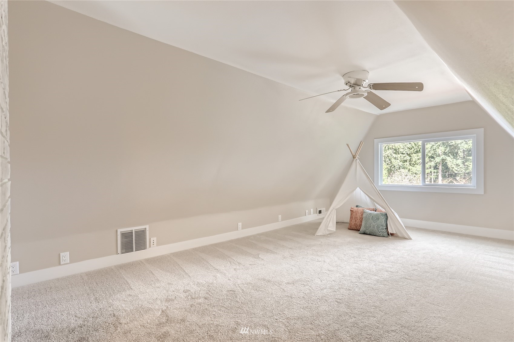 19810 43rd Avenue Southeast Bothell, WA 98012 - Photo 24 of 40 an empty room with windows and fan