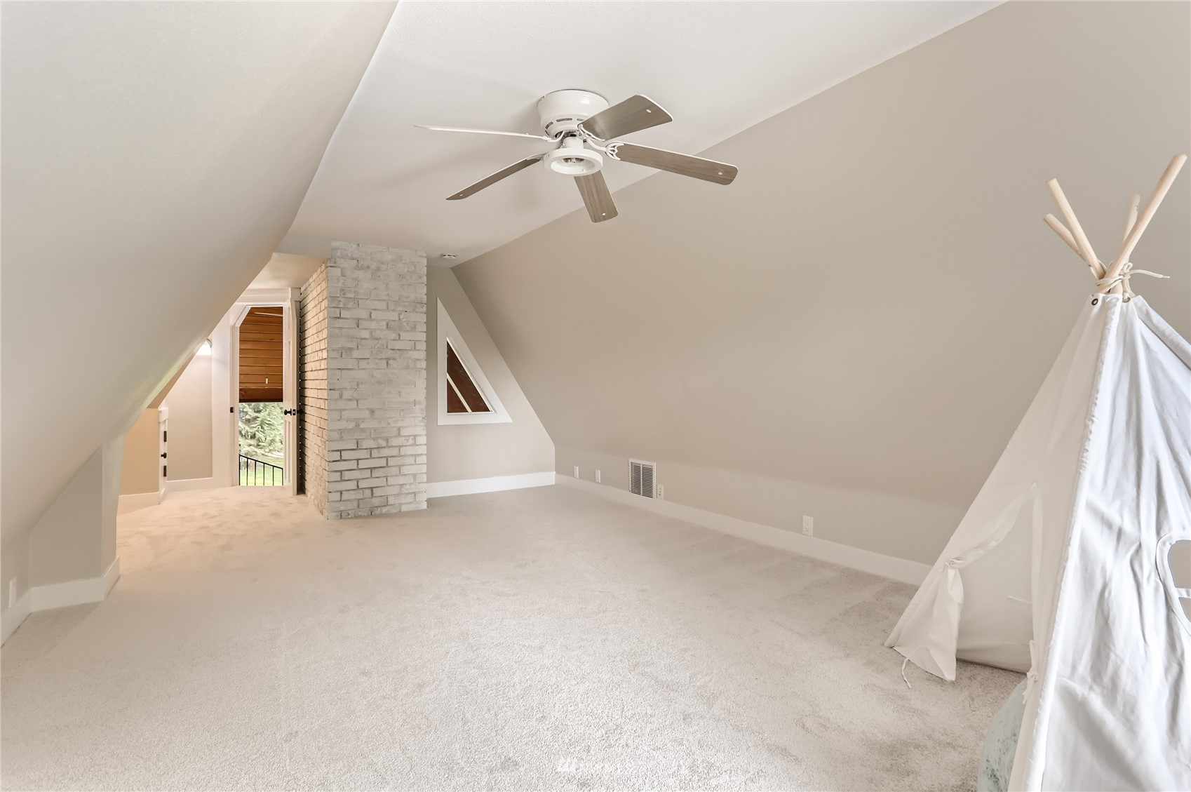 19810 43rd Avenue Southeast Bothell, WA 98012 - Photo 25 of 40 a view of an empty room with stairs and a ceiling fan