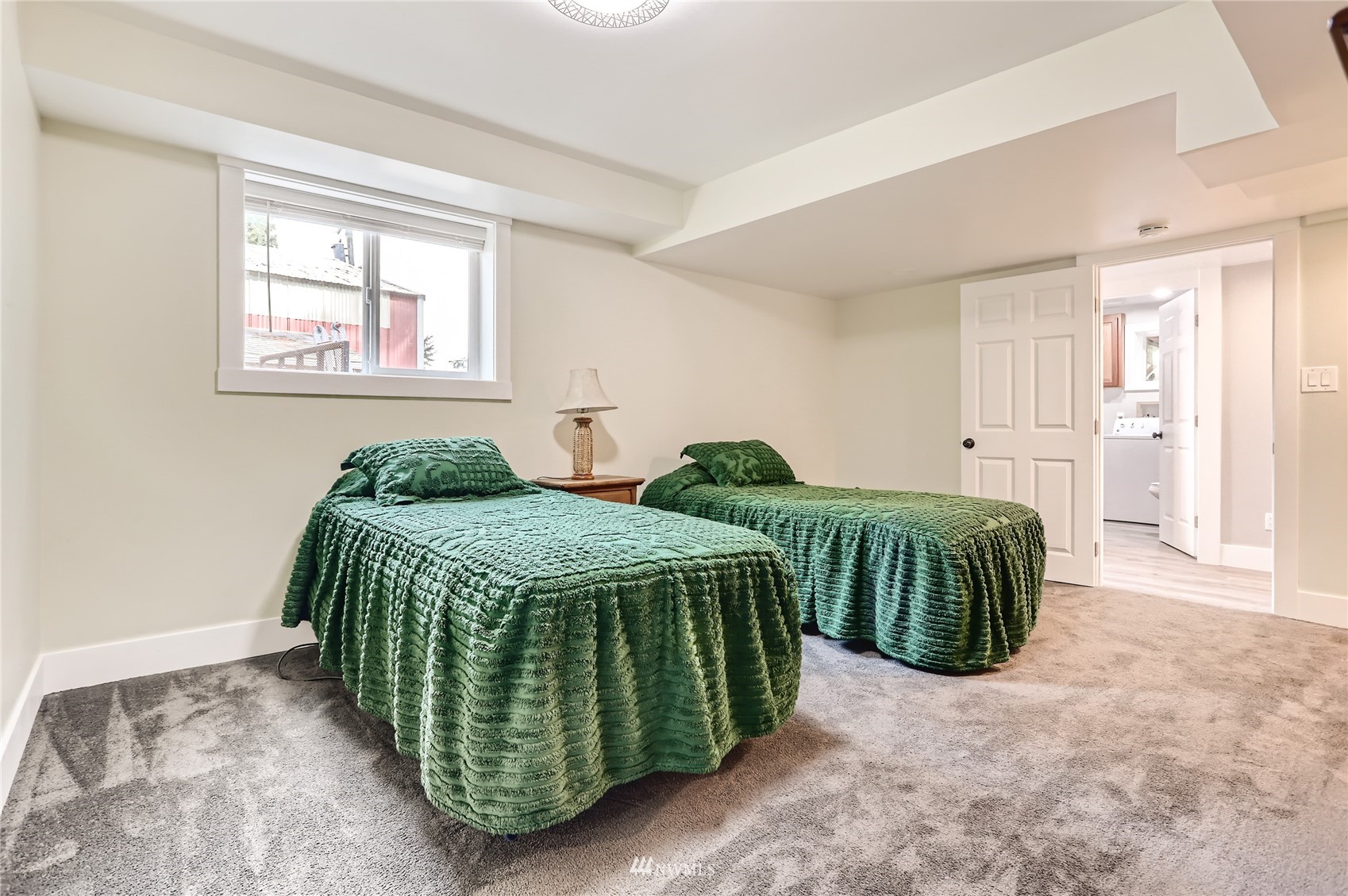 19810 43rd Avenue Southeast Bothell, WA 98012 - Photo 30 of 40 a bedroom with a bed and a window