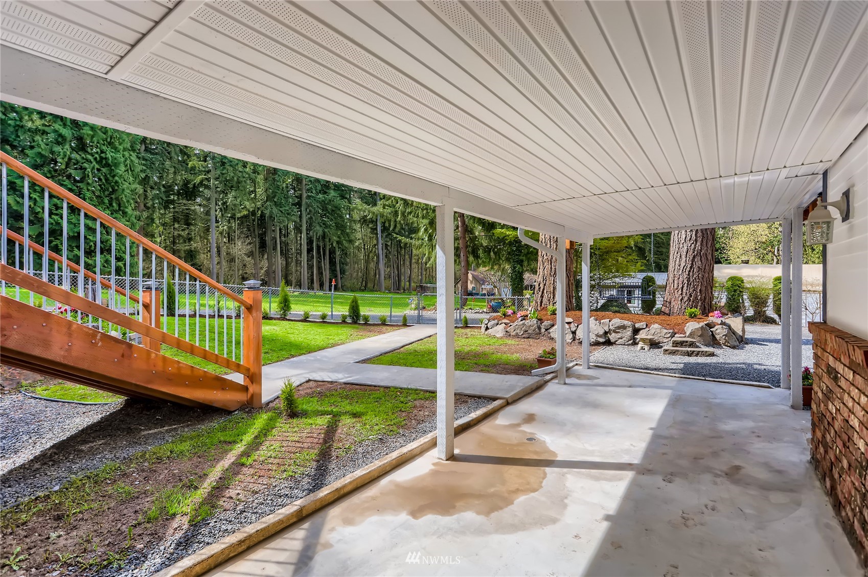 19810 43rd Avenue Southeast Bothell, WA 98012 - Photo 33 of 40 a view of a patio with chairs and a yard