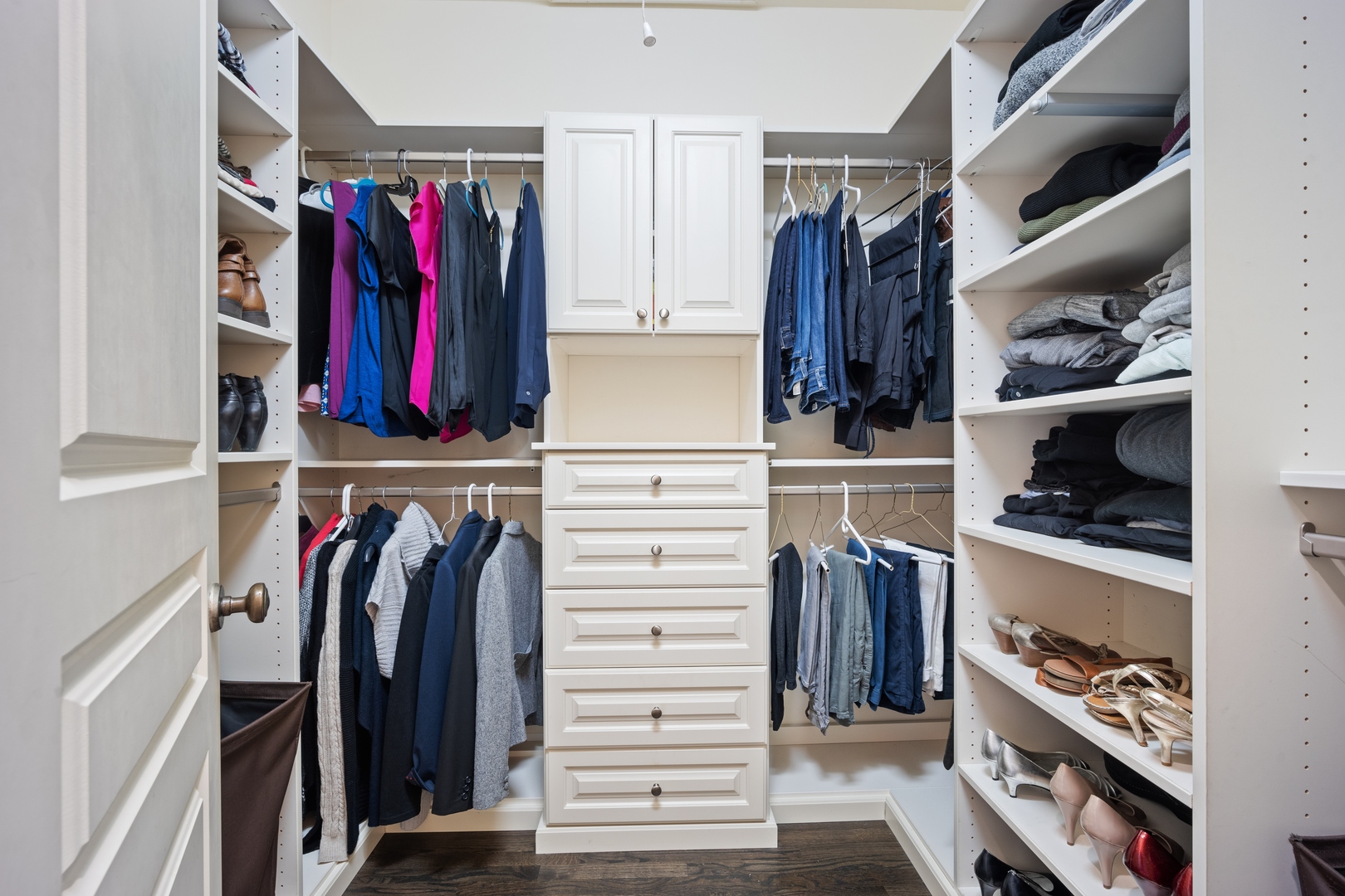 500 Deerfield Road Deerfield, IL 60015 - Photo 12 of 27 a view of walk in closet with clothes and shoes