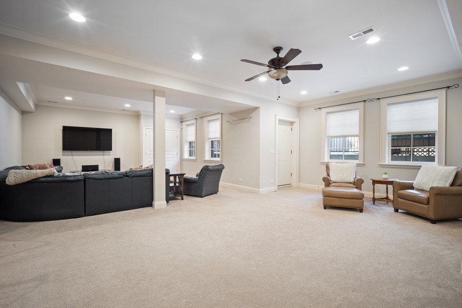 500 Deerfield Road Deerfield, IL 60015 - Photo 20 of 27 a living room with furniture and a flat screen tv
