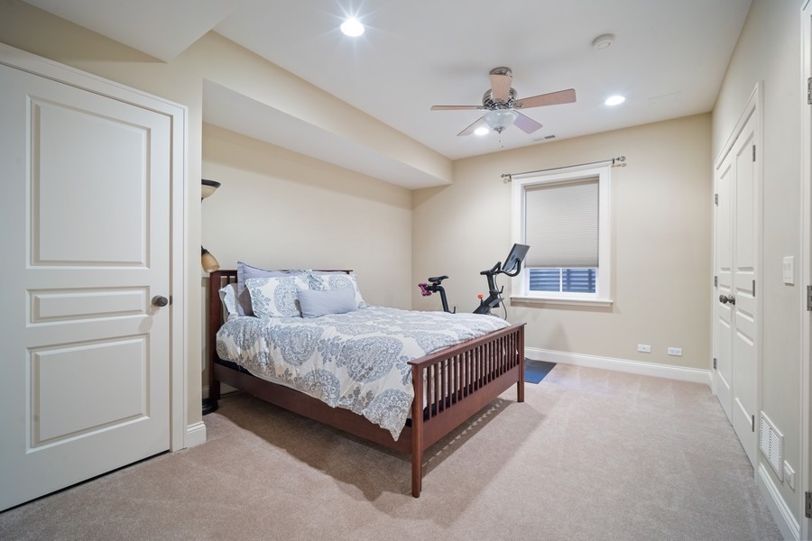 500 Deerfield Road Deerfield, IL 60015 - Photo 22 of 27 a living room with a bed and furniture