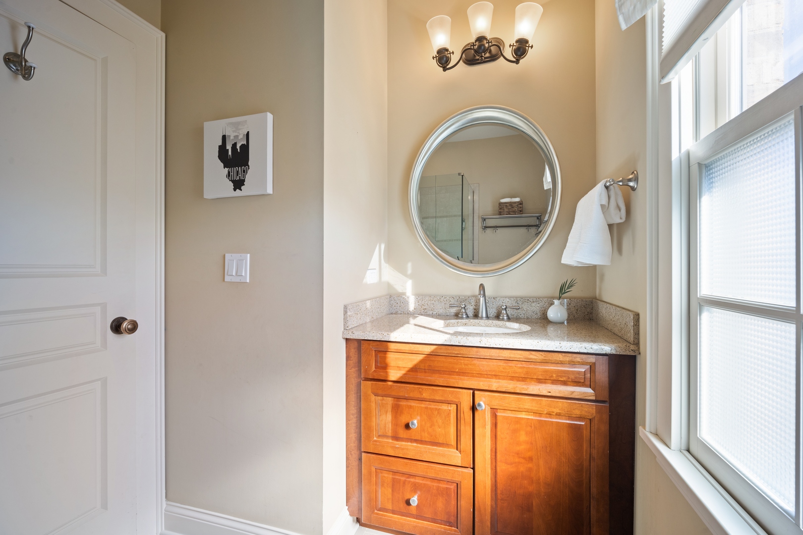 500 Deerfield Road Deerfield, IL 60015 - Photo 7 of 27 a bathroom with a granite countertop toilet a sink and a mirror