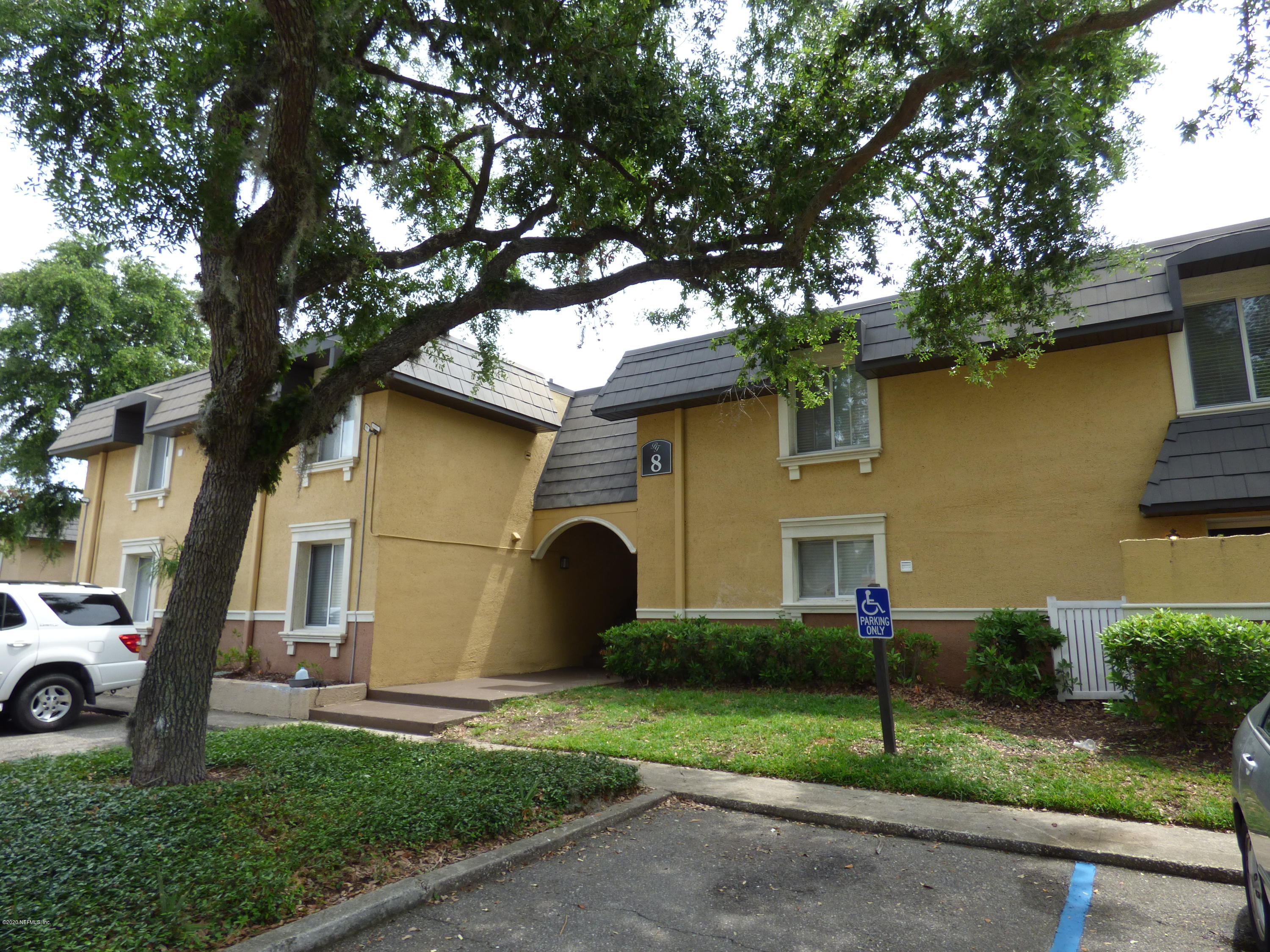 355 Monument Road, Unit 8 D2 Jacksonville, FL 32225 - Photo 1 of 19 a front view of a house with garden