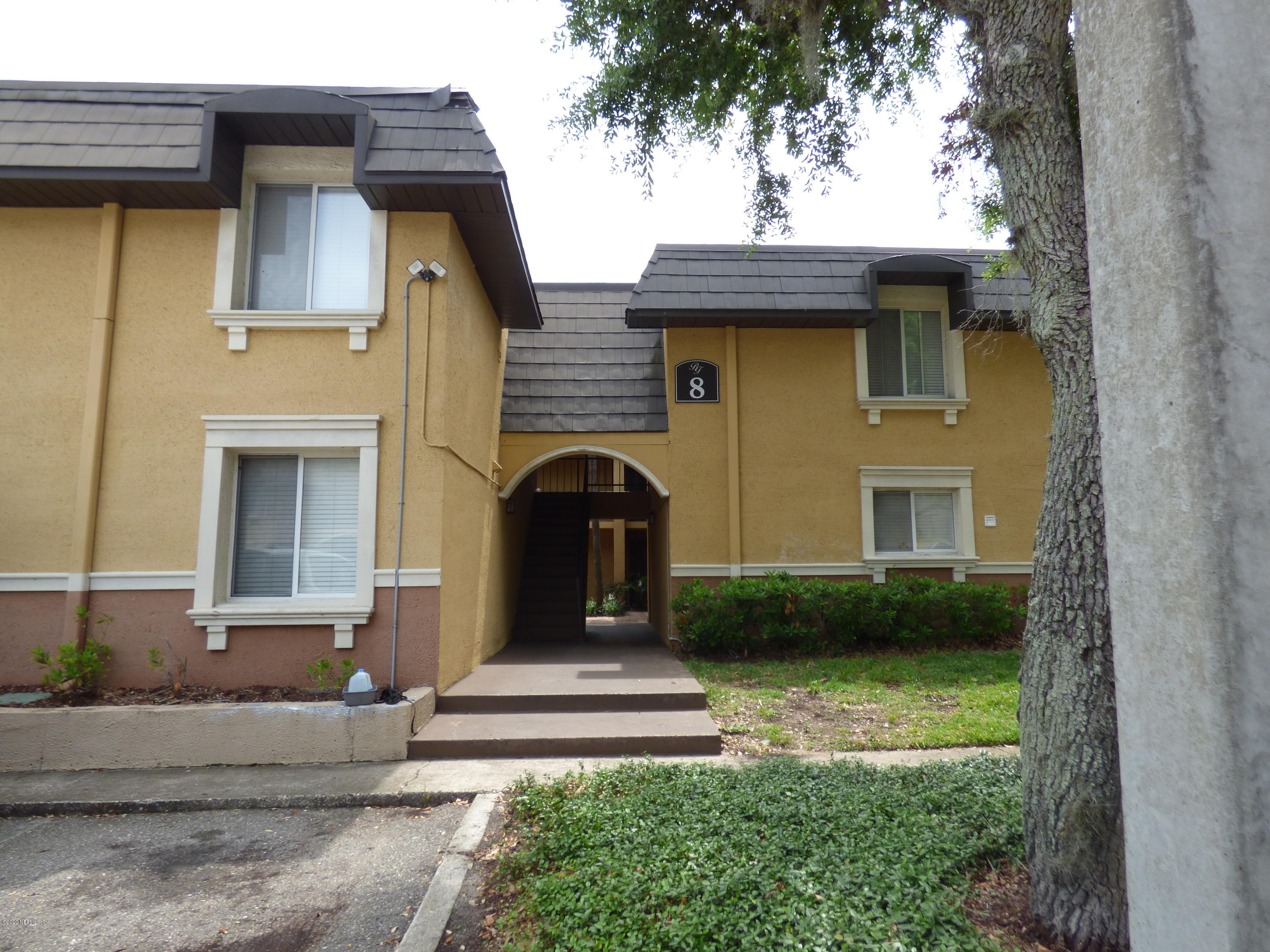 355 Monument Road, Unit 8 D2 Jacksonville, FL 32225 - Photo 14 of 19 a front view of a house with garden