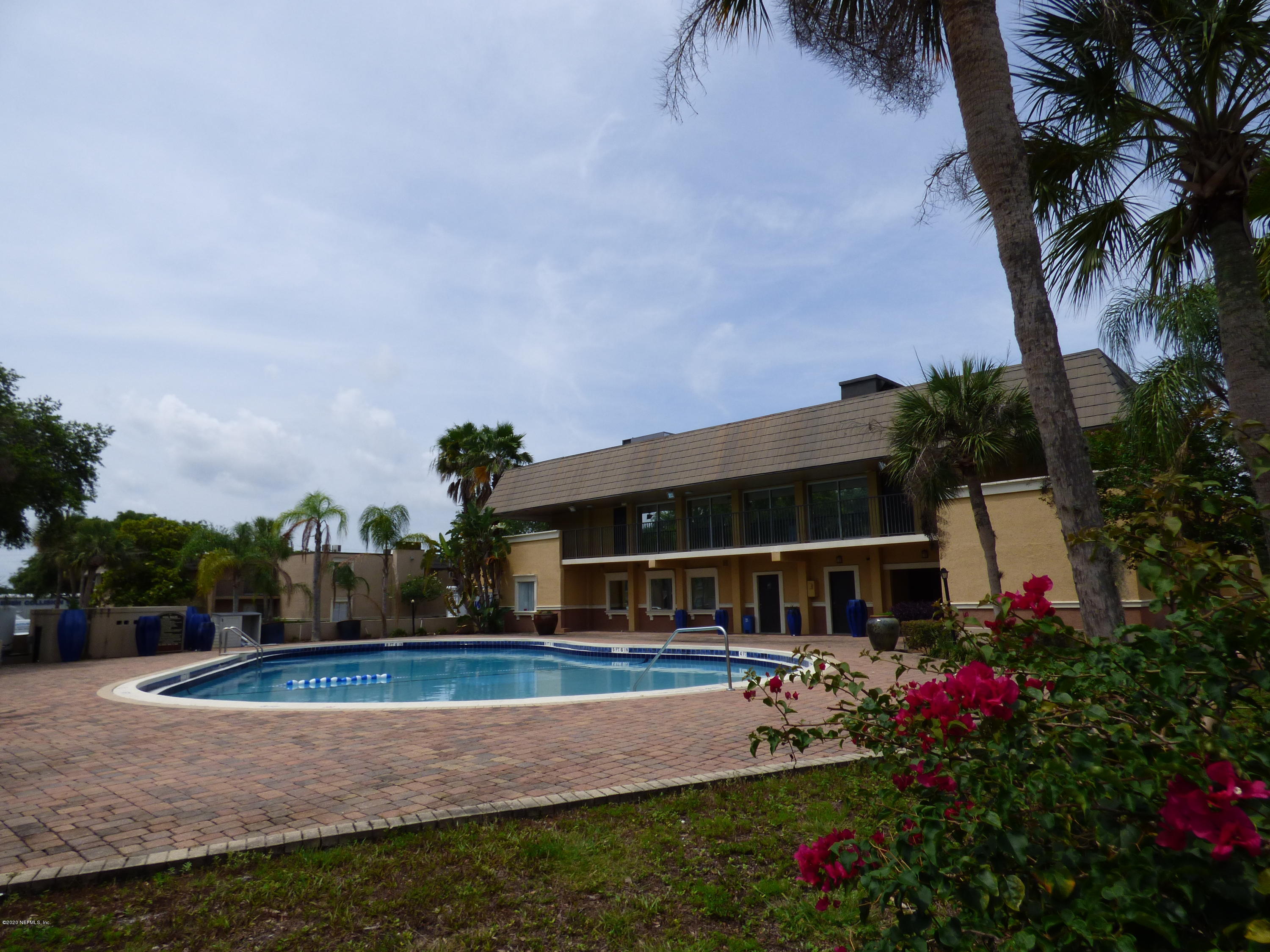 355 Monument Road, Unit 8 D2 Jacksonville, FL 32225 - Photo 16 of 19 a view of house with swimming pool and a yard