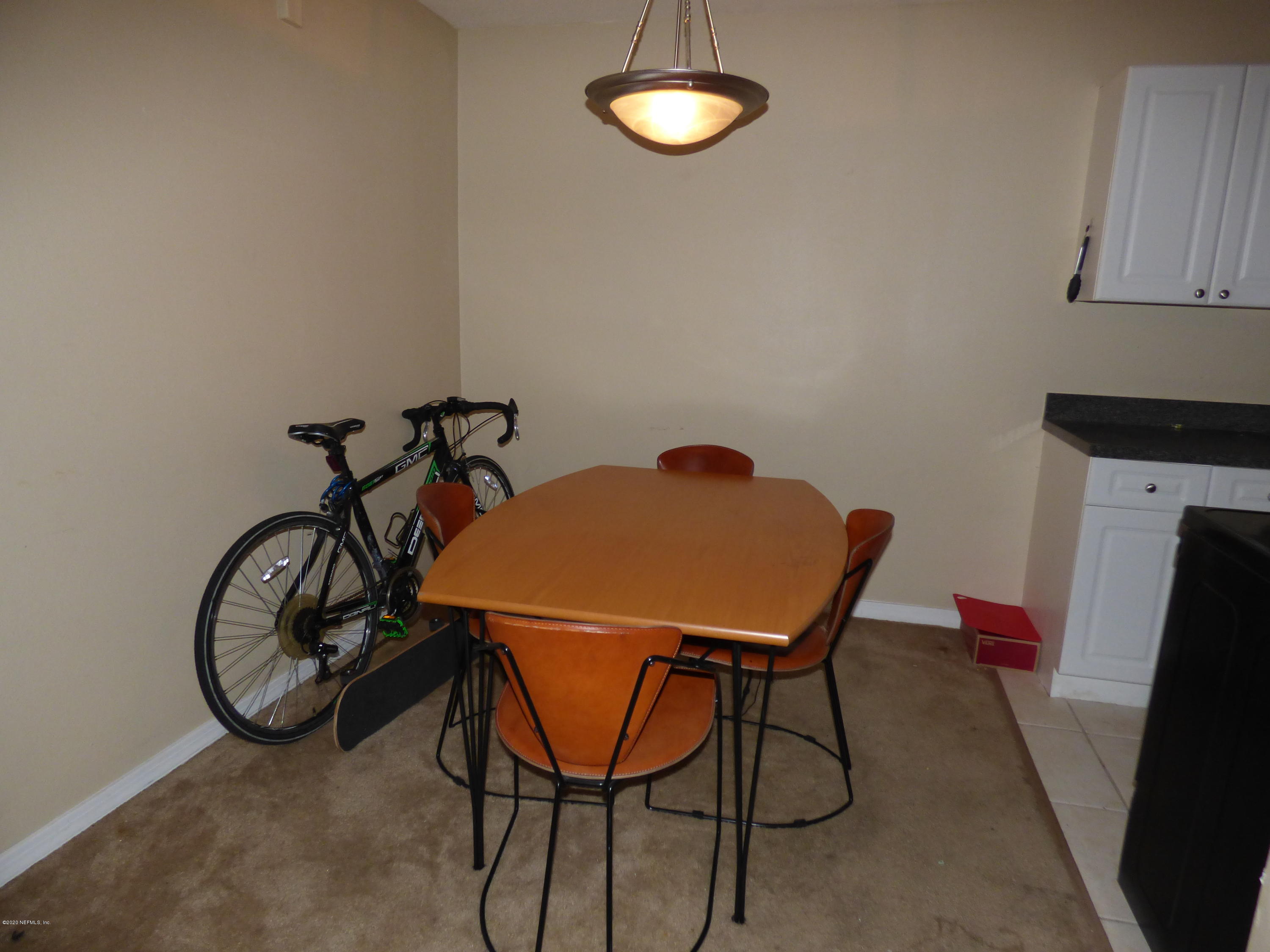 355 Monument Road, Unit 8 D2 Jacksonville, FL 32225 - Photo 5 of 19 a view of a room with furniture and a window