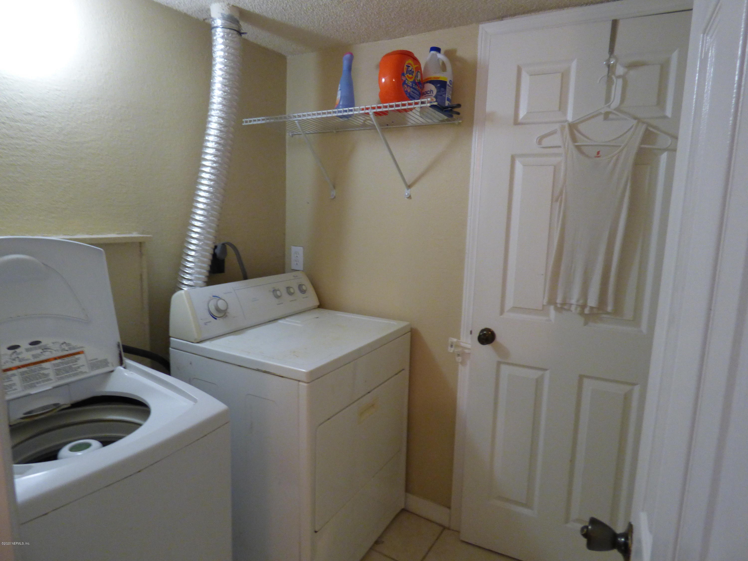 355 Monument Road, Unit 8 D2 Jacksonville, FL 32225 - Photo 9 of 19 a utility room with dryer and washer