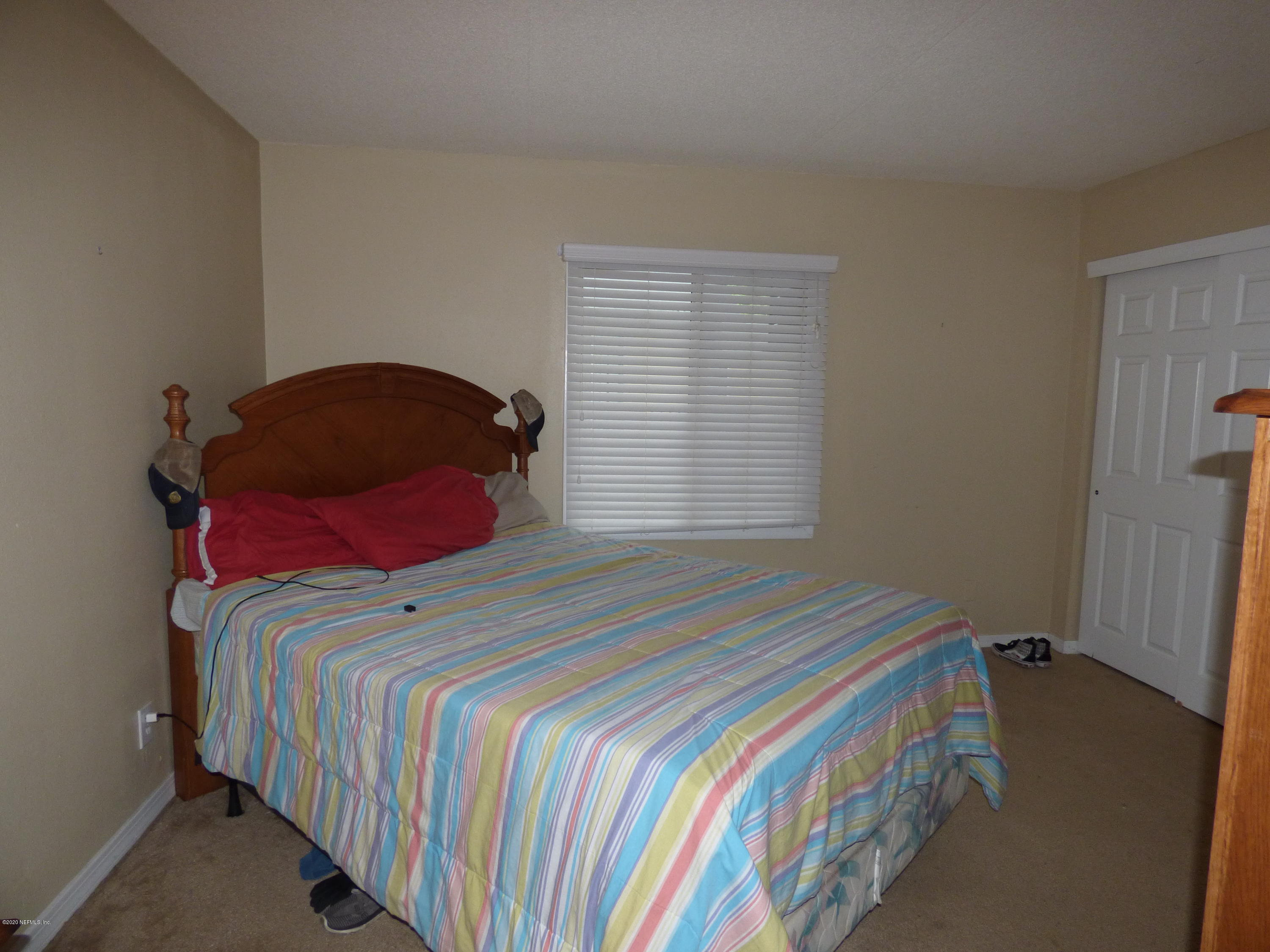 355 Monument Road, Unit 8 D2 Jacksonville, FL 32225 - Photo 10 of 19 a bedroom with a bed and a window