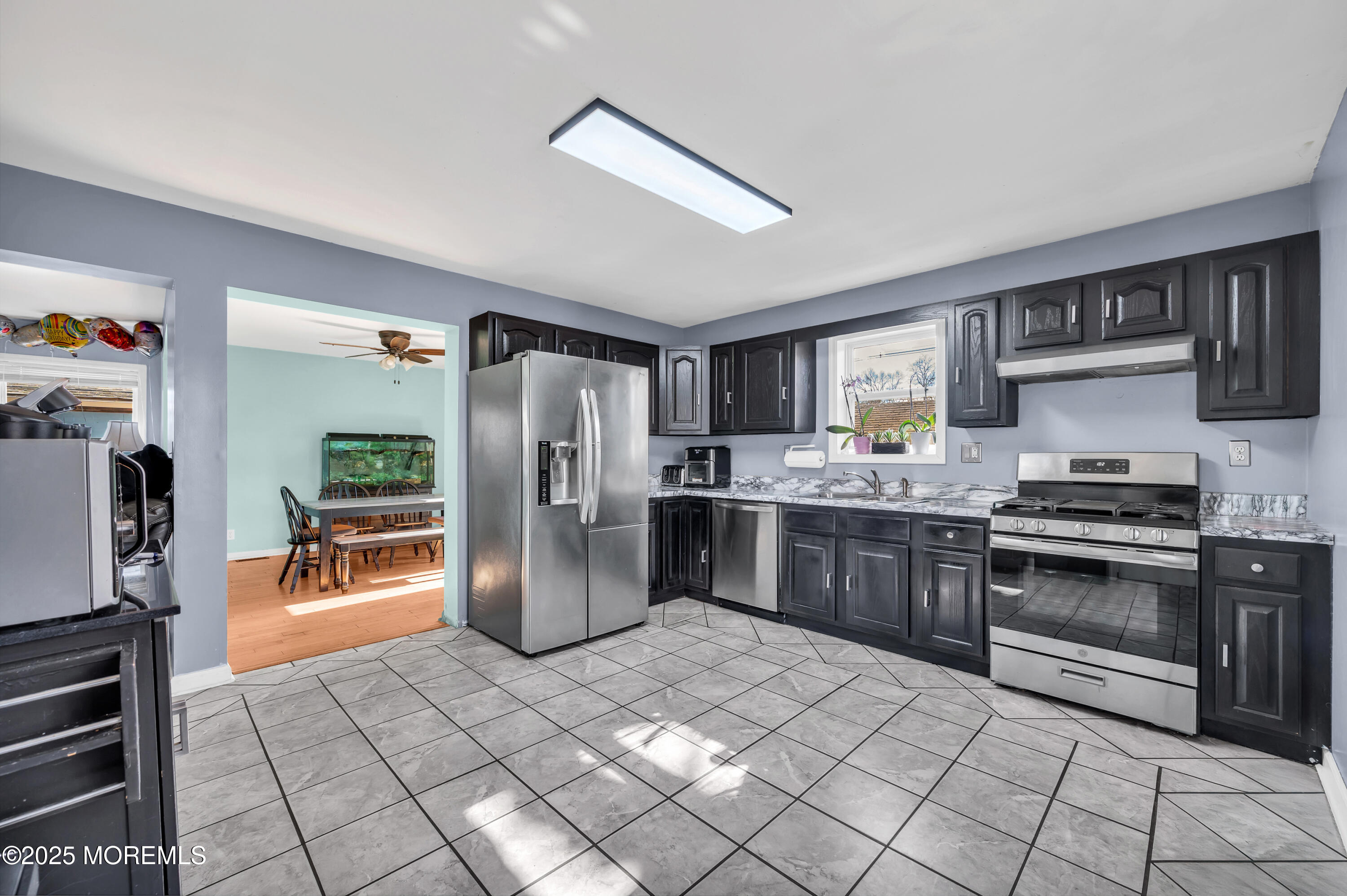 22 Liverpool Road Brick, NJ 08723 - Photo 13 of 36 a kitchen with stainless steel appliances granite countertop a refrigerator stove and sink