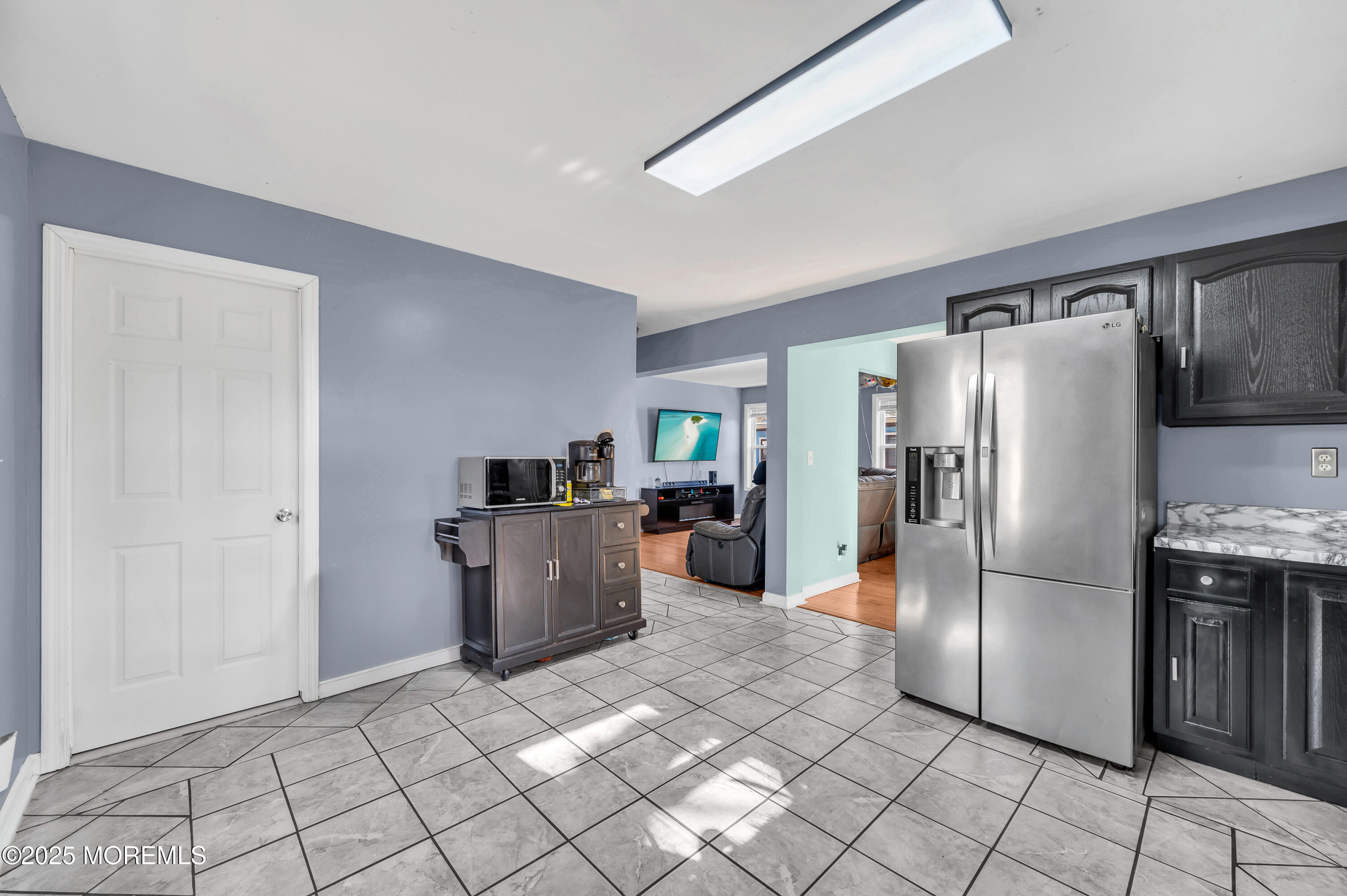 22 Liverpool Road Brick, NJ 08723 - Photo 15 of 36 a kitchen with a refrigerator a microwave and a sink