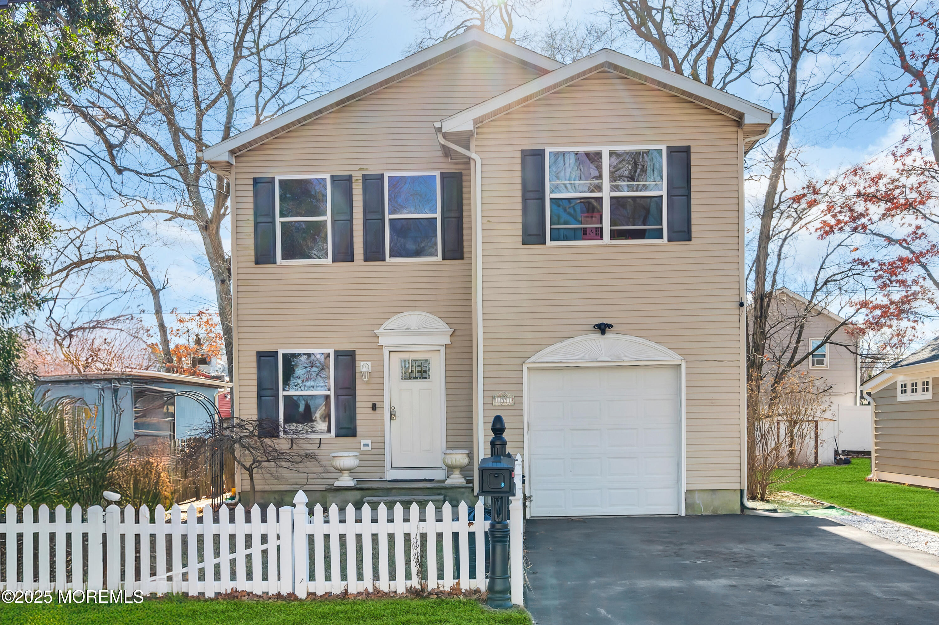 22 Liverpool Road Brick, NJ 08723 - Photo 2 of 36 a front view of a house with a yard