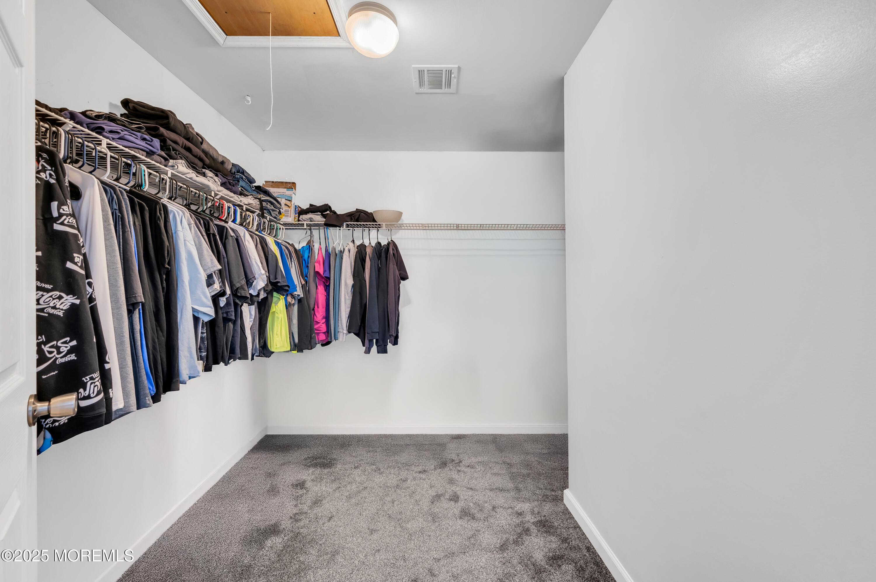 22 Liverpool Road Brick, NJ 08723 - Photo 21 of 36 a view of walk in closet with clothes