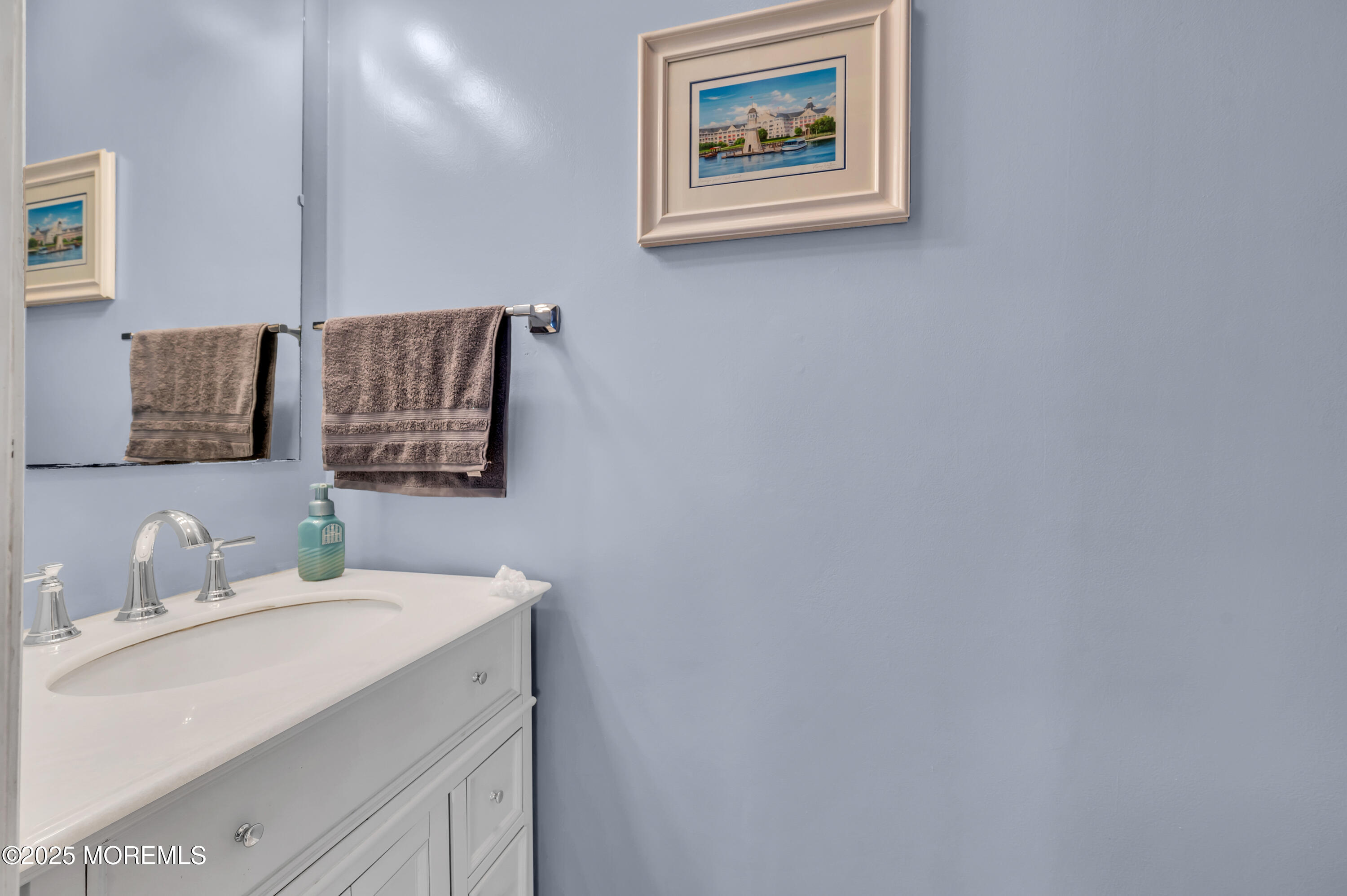 22 Liverpool Road Brick, NJ 08723 - Photo 24 of 36 a bathroom with a sink and a mirror