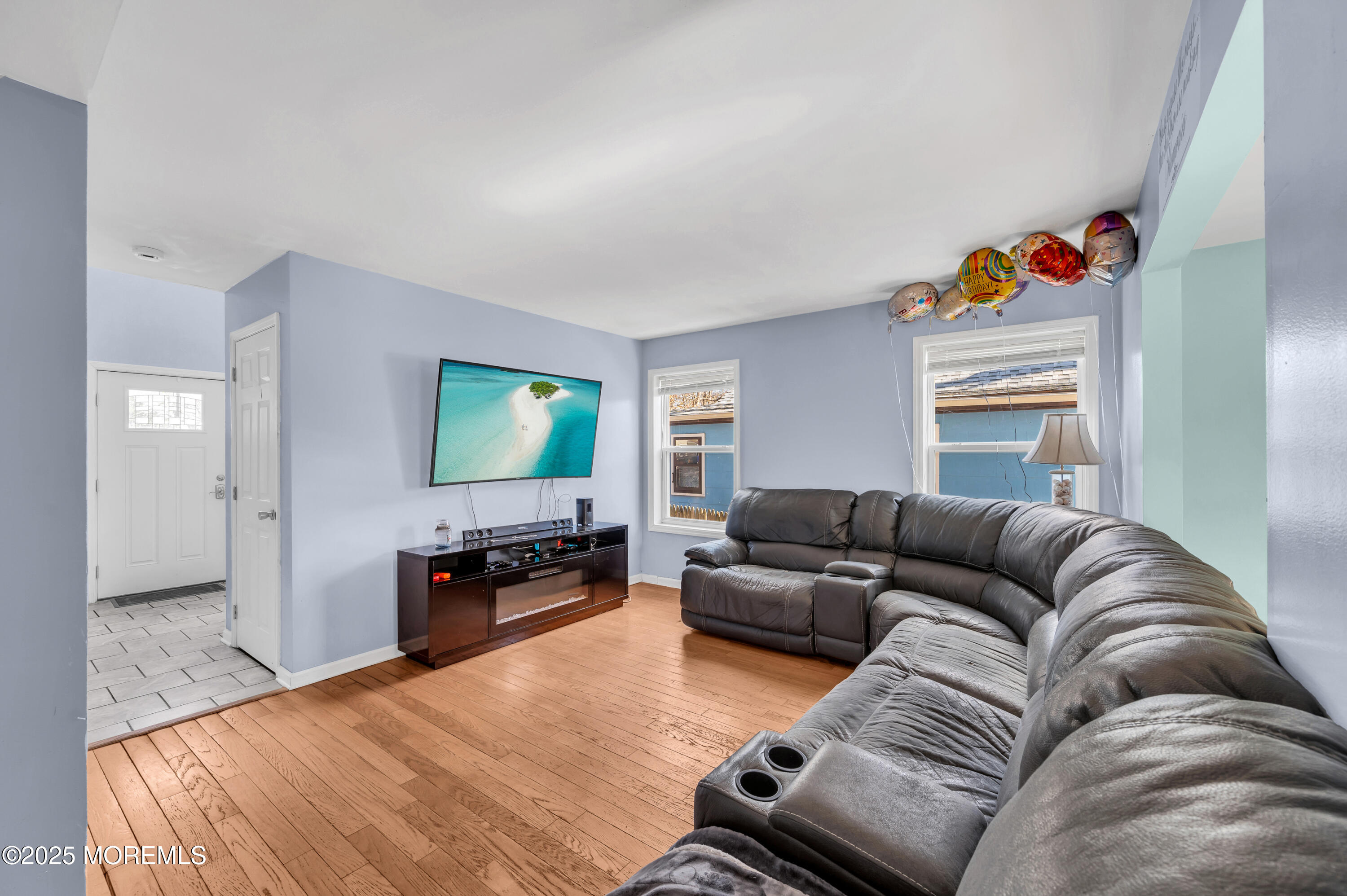 22 Liverpool Road Brick, NJ 08723 - Photo 6 of 36 a living room with furniture and a flat screen tv