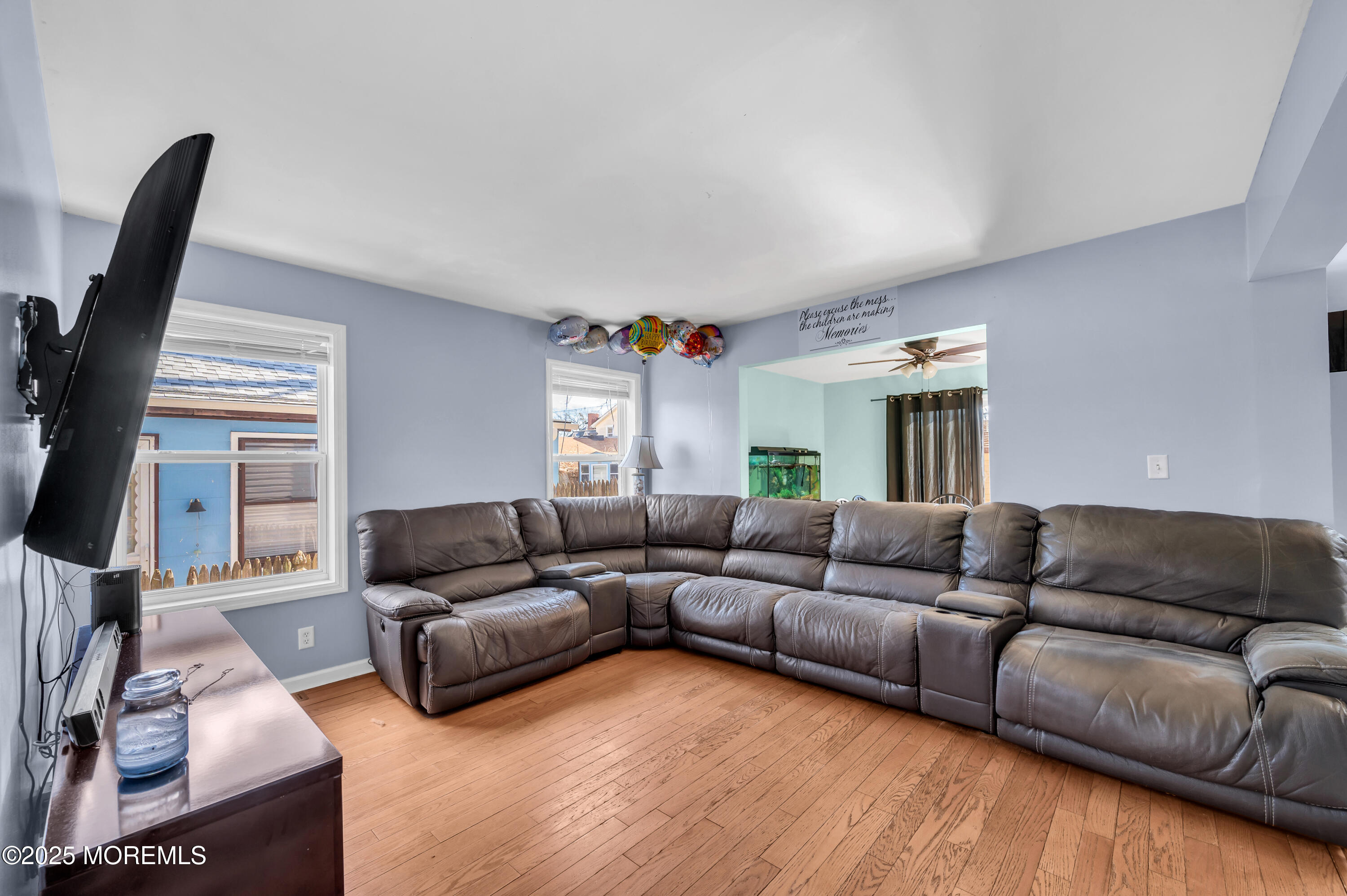 22 Liverpool Road Brick, NJ 08723 - Photo 7 of 36 a living room with furniture a fireplace and a flat screen tv