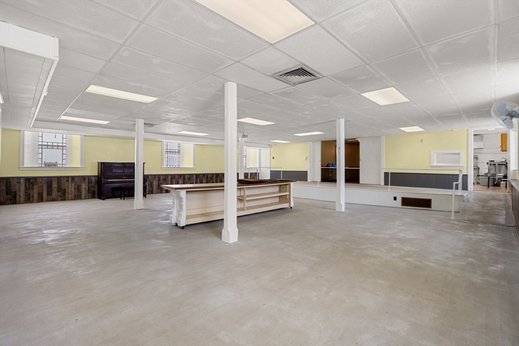 437 Main Street Southbridge, MA 01550 - Photo 11 of 31 a view of a big room with entryway table and chairs