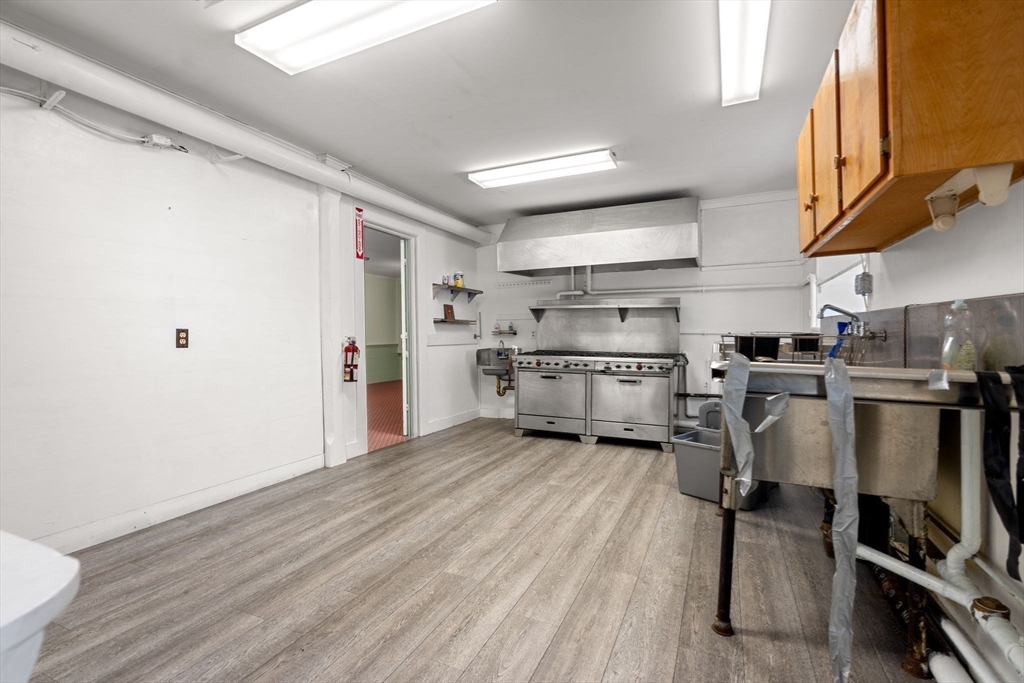 437 Main Street Southbridge, MA 01550 - Photo 15 of 31 a kitchen with stainless steel appliances granite countertop a refrigerator and a stove top oven