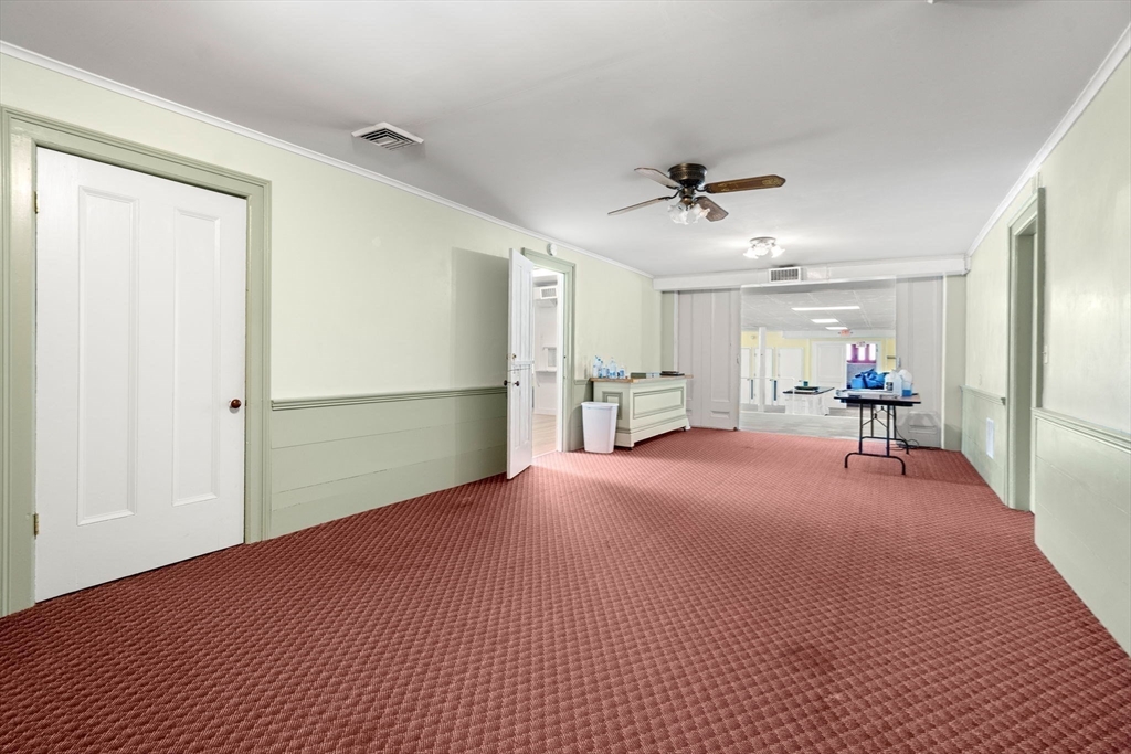 437 Main Street Southbridge, MA 01550 - Photo 18 of 31 a view of a livingroom with a furniture and a ceiling fan