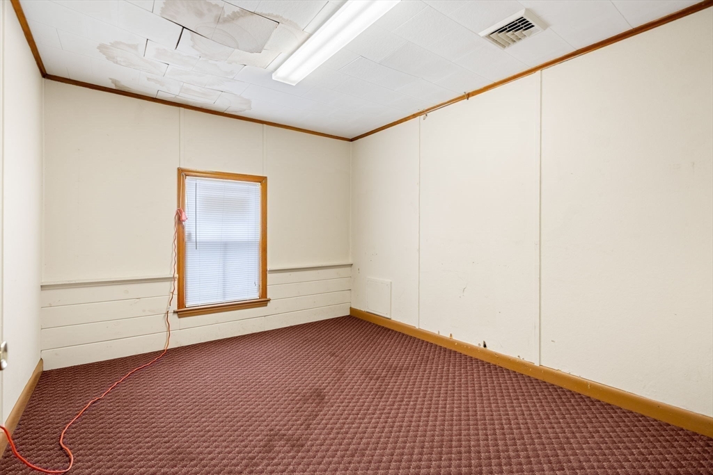 437 Main Street Southbridge, MA 01550 - Photo 19 of 31 a view of an empty room with a window