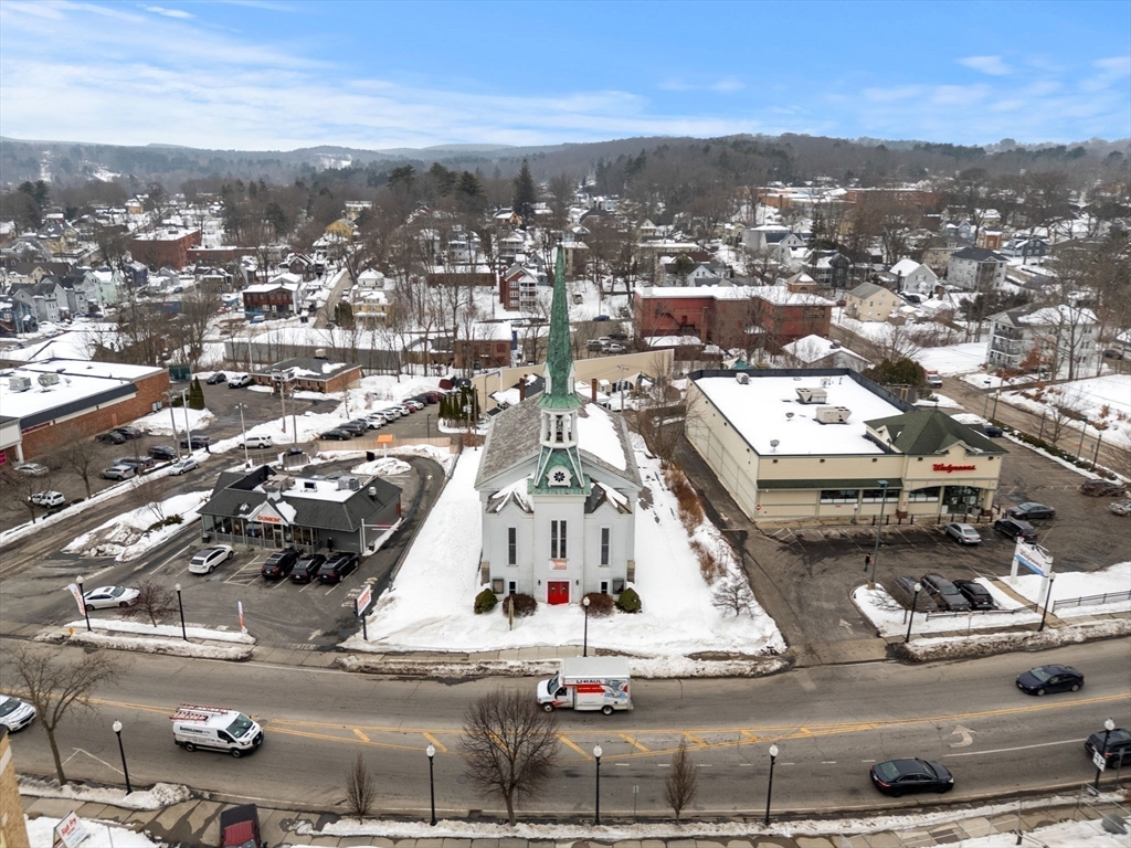 437 Main Street Southbridge, MA 01550 - Photo 3 of 31 an aerial view of residential houses with city view