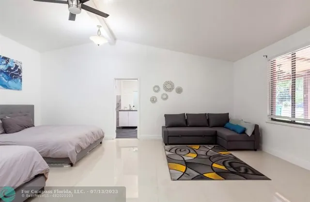 a living room with furniture and a window
