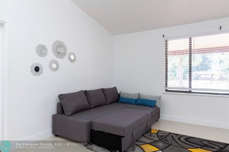 11450 Southwest 17th Street Davie, FL 33325 - Photo 23 of 56 a bedroom with a bed and window