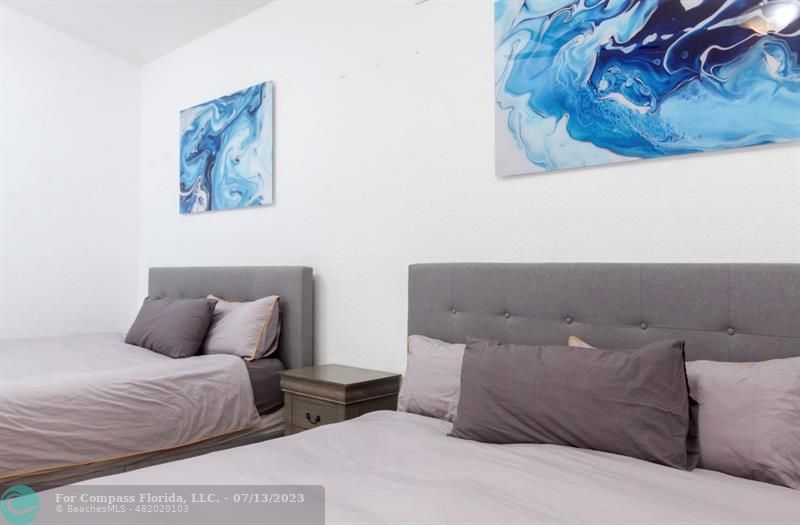 11450 Southwest 17th Street Davie, FL 33325 - Photo 25 of 56 a bedroom with a bed and a lamp