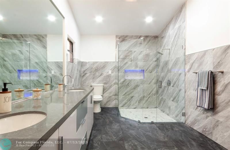 11450 Southwest 17th Street Davie, FL 33325 - Photo 28 of 56 a spacious bathroom with a granite countertop sink a toilet and shower