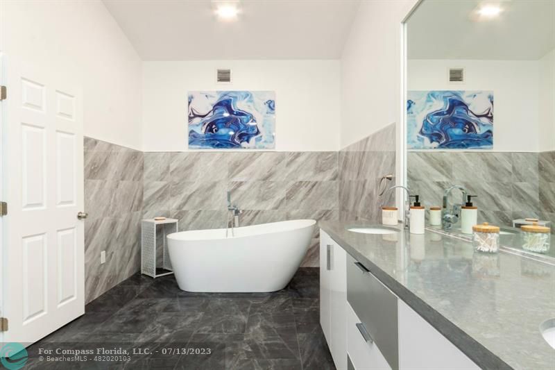 11450 Southwest 17th Street Davie, FL 33325 - Photo 31 of 56 a bathroom with a sink and a mirror