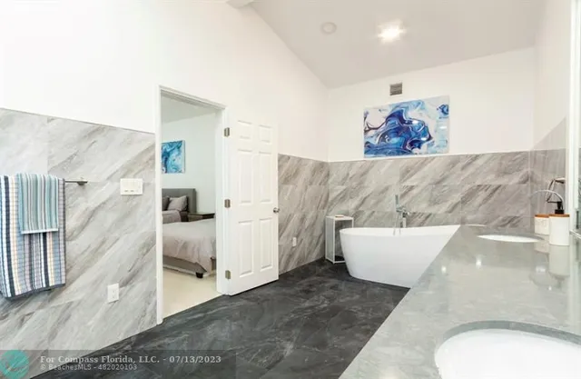 a bathroom with a shower and a sink