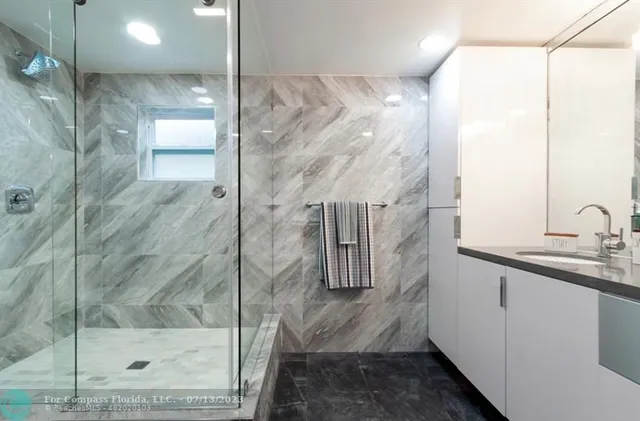 a bedroom with a bed dresser and a window