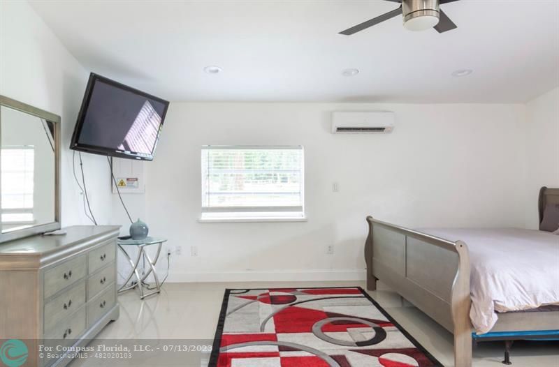 11450 Southwest 17th Street Davie, FL 33325 - Photo 39 of 56 a bedroom with a bed dresser and a window