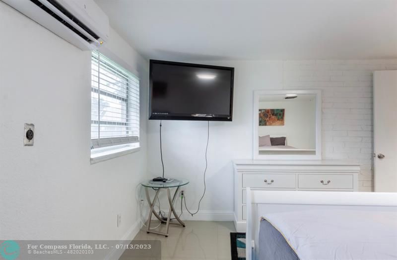 11450 Southwest 17th Street Davie, FL 33325 - Photo 44 of 56 a living room with a flat screen tv and a window