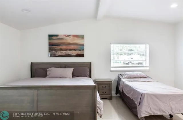 a view of a wooden fence with a bench in patio