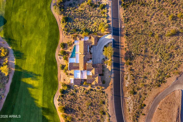 a view of an aerial view of residential houses with outdoor space and trees