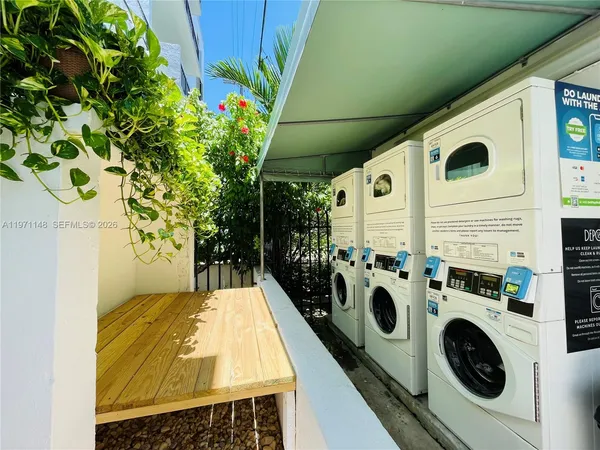 a view of a storage & utility room with washer and dryer