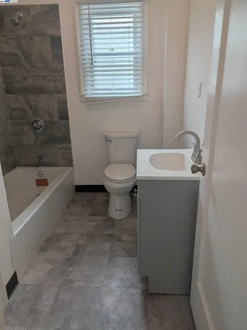 a bathroom with a sink toilet and bathtub