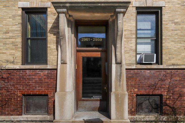 2961 North Halsted Street, Unit 3 Chicago, IL 60657 - Photo 2 of 19 a front view of a house with a door and a window