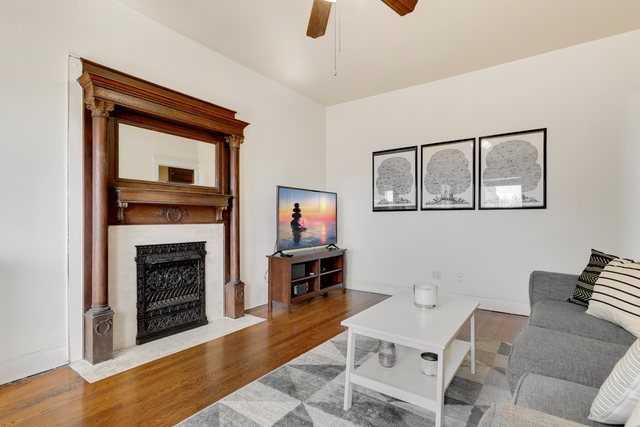 2961 North Halsted Street, Unit 3 Chicago, IL 60657 - Photo 4 of 19 a living room with furniture and a fireplace