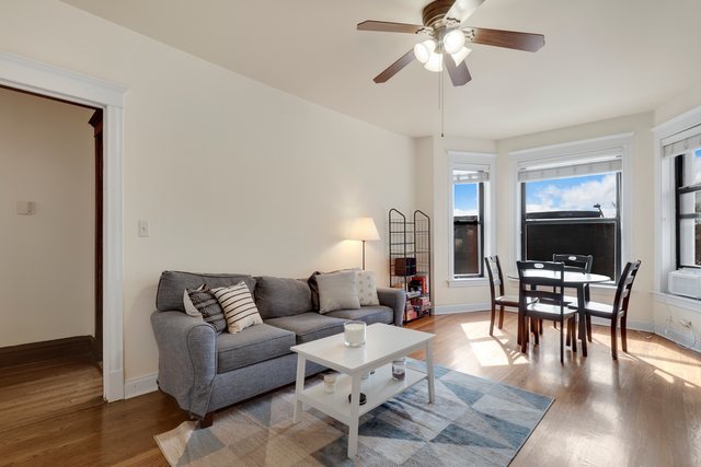 2961 North Halsted Street, Unit 3 Chicago, IL 60657 - Photo 6 of 19 a living room with furniture and a flat screen tv