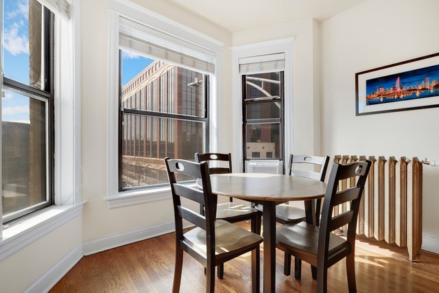 2961 North Halsted Street, Unit 3 Chicago, IL 60657 - Photo 7 of 19 a view of a dining room with furniture and wooden floor