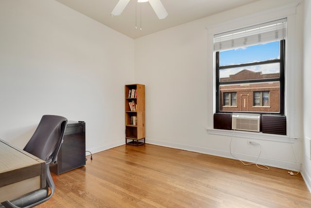 2961 North Halsted Street, Unit 3 Chicago, IL 60657 - Photo 9 of 19 a living room with furniture and wooden floor