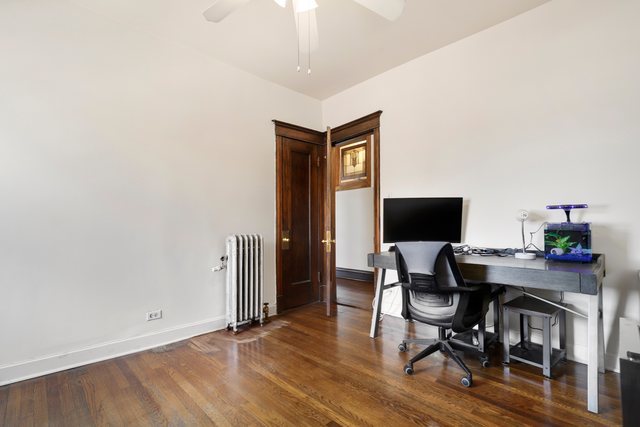 2961 North Halsted Street, Unit 3 Chicago, IL 60657 - Photo 10 of 19 a view of a workspace with furniture and wooden floor